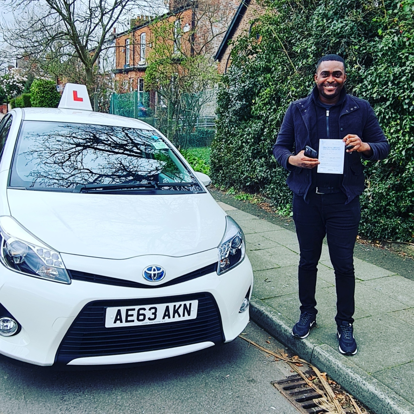 Man with driving diploma in hand