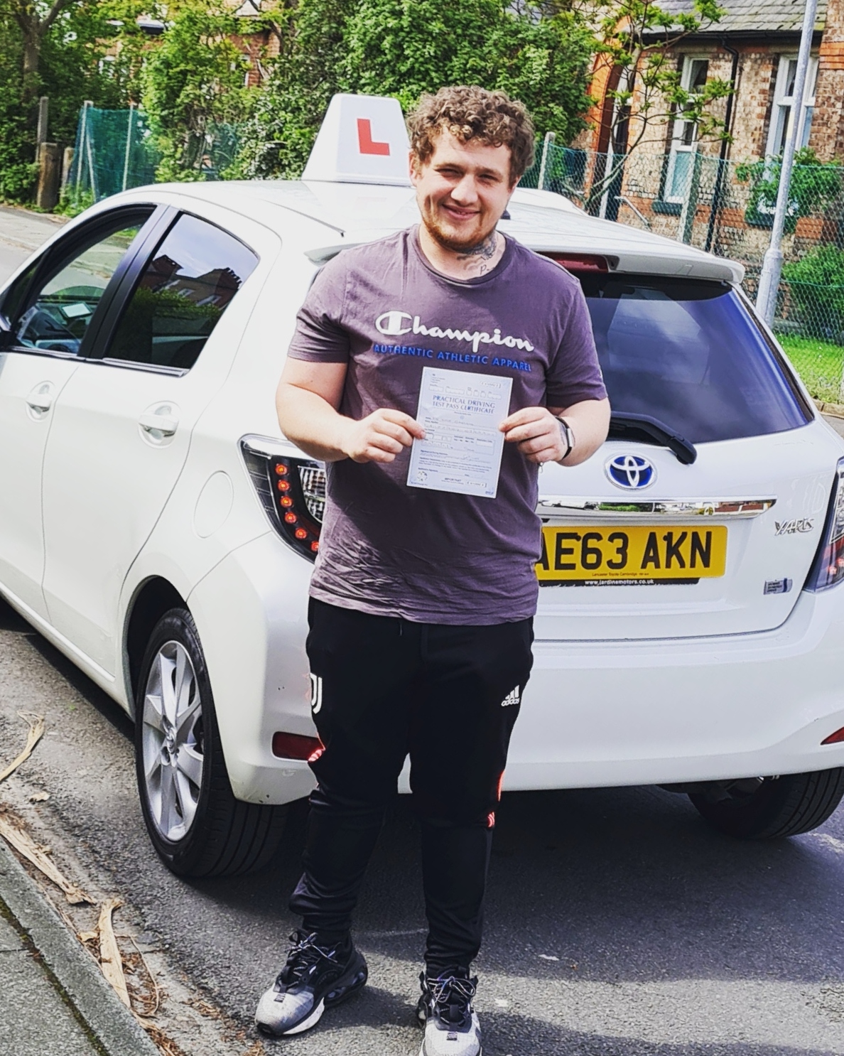 Man with driving diploma in hand