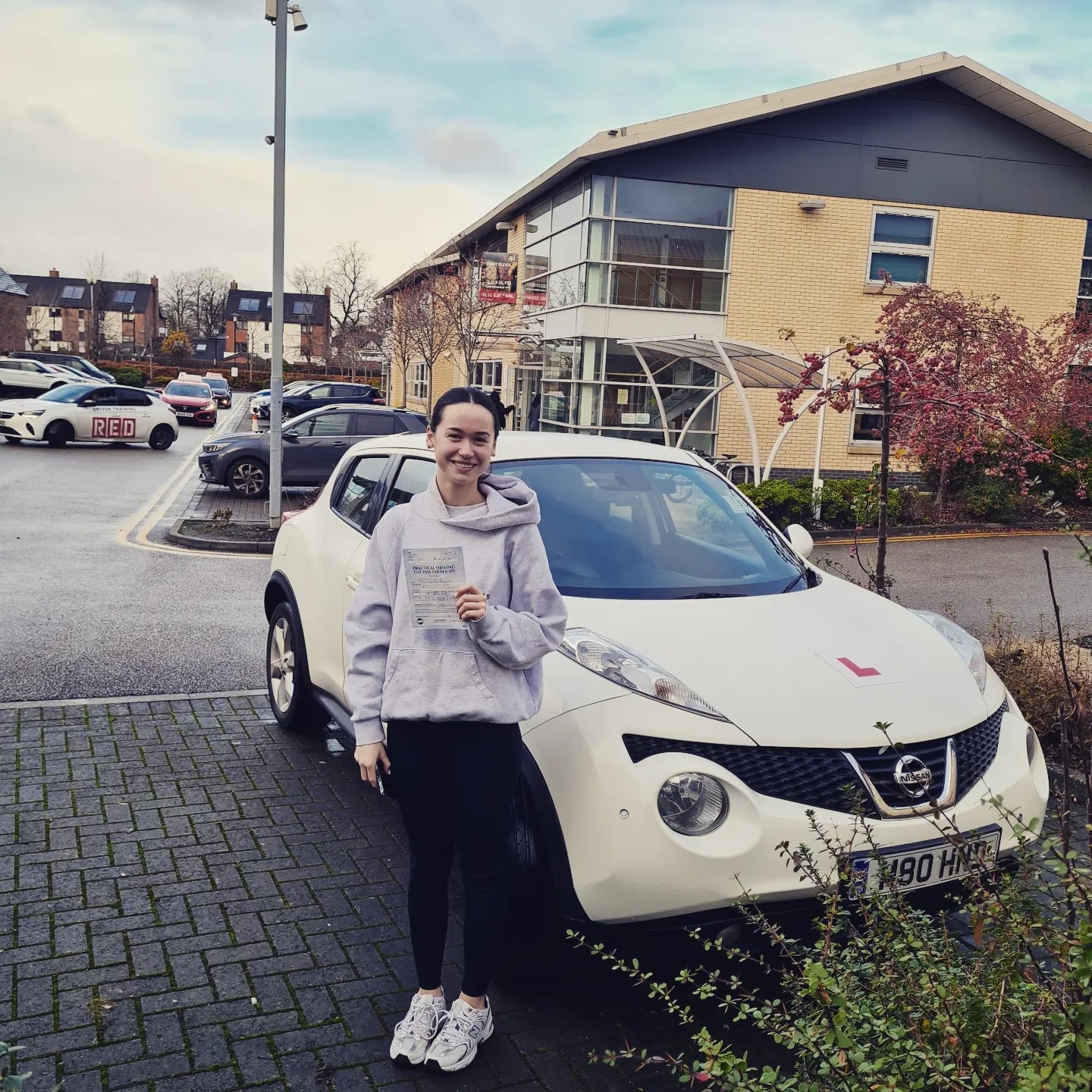 Girl with driving diploma in hand